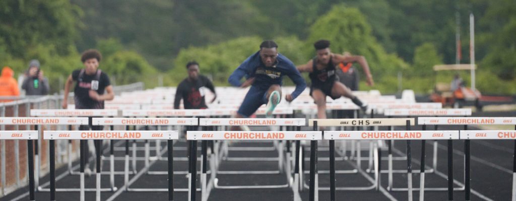 churchland high school track team jumping hurdles